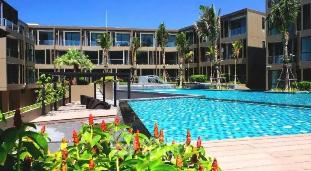 Luxurious modern apartment complex with stunning pool and lush landscaping.