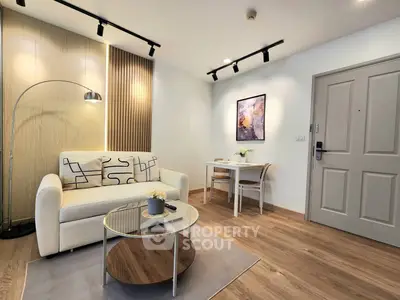 Modern living room with stylish decor and cozy seating area, perfect for relaxation and entertaining.