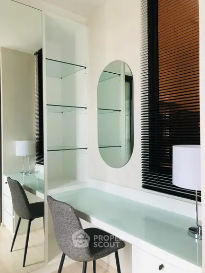 Modern study area with sleek desk, chair, and mirror in stylish apartment