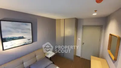 Cozy living room with modern decor and comfortable seating in a stylish apartment.