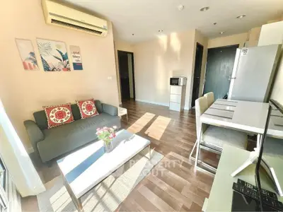 Bright modern living room with stylish decor and open kitchen layout