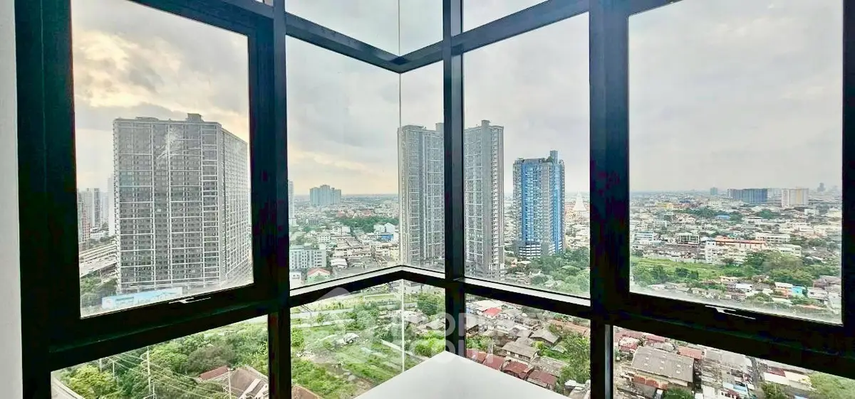 Stunning corner unit with panoramic city views from floor-to-ceiling windows.