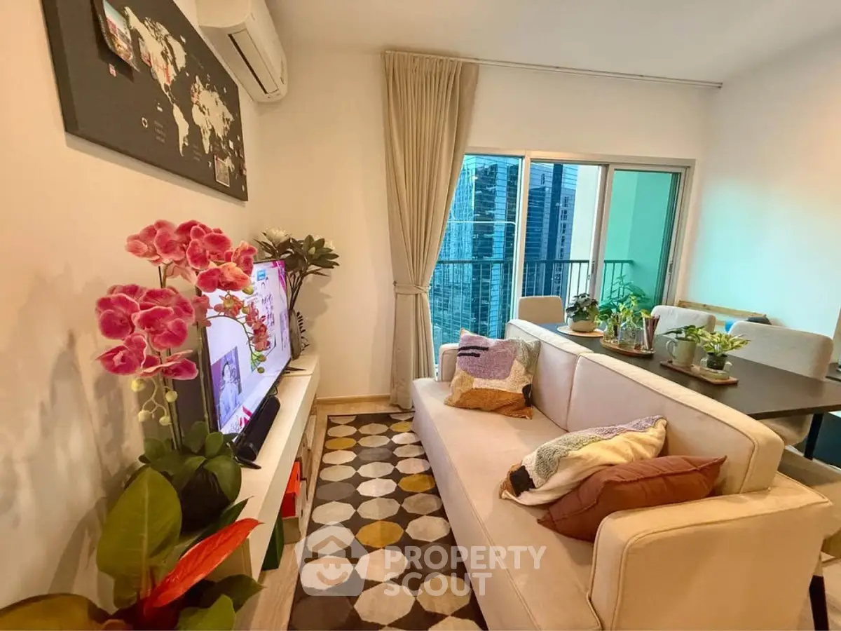 Stylish living room with modern decor and balcony view in urban apartment