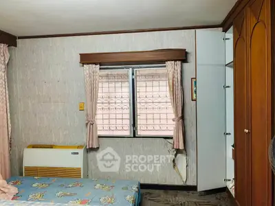 Cozy bedroom with vintage decor and natural light from window