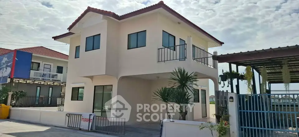 Charming two-story house with modern design and spacious driveway in a serene neighborhood.