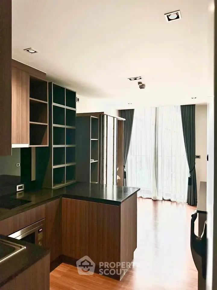 Modern kitchen with sleek wooden cabinets and open layout design