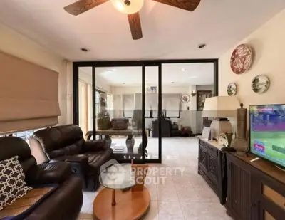 Spacious living room with cozy leather seating and modern decor