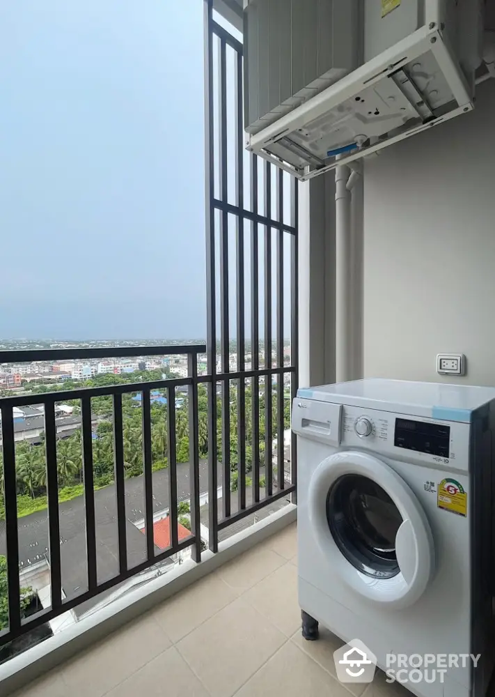 High-rise balcony with washing machine and scenic city view