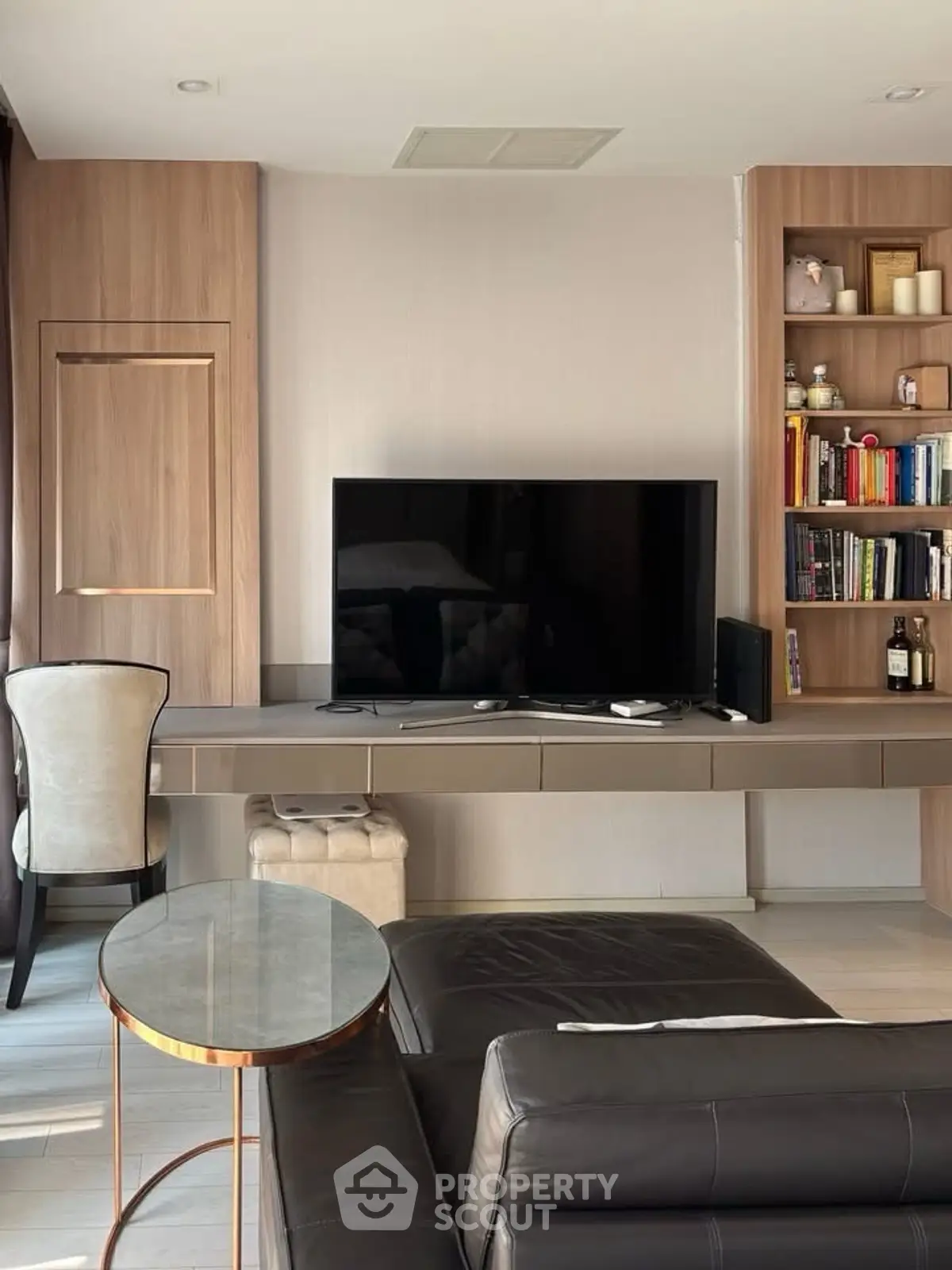 Modern living room with sleek TV setup and stylish furniture