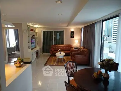 Spacious living room with modern decor and city view, featuring leather sofas and elegant dining area.