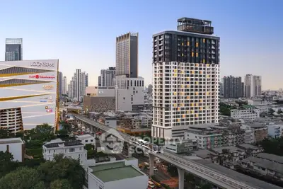 Stunning cityscape view featuring modern high-rise buildings and urban skyline at dusk.
