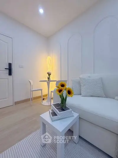 Charming living room with cozy seating and elegant decor, perfect for relaxation and entertaining.