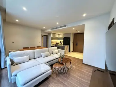 Spacious modern living room with open kitchen and elegant decor