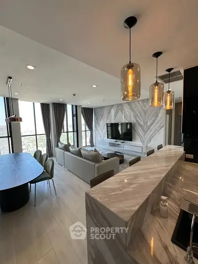 Luxurious modern living room with open kitchen and panoramic city view
