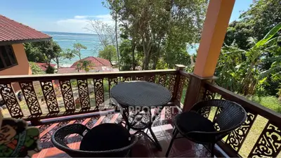 Charming balcony with ocean view, perfect for relaxation and enjoying the sea breeze.