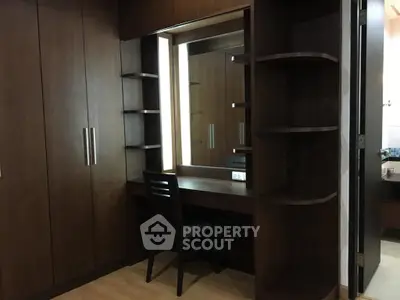 Elegant wooden wardrobe with built-in vanity in modern bedroom