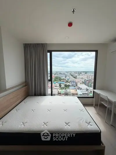 Spacious bedroom with stunning city view and modern furnishings