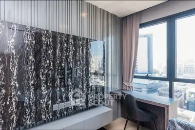Modern study area with marble accent wall and city view, perfect for productivity and style.