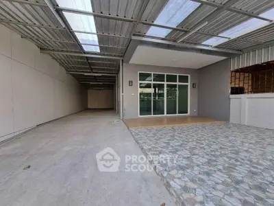 Spacious covered parking area with modern design and tiled entrance