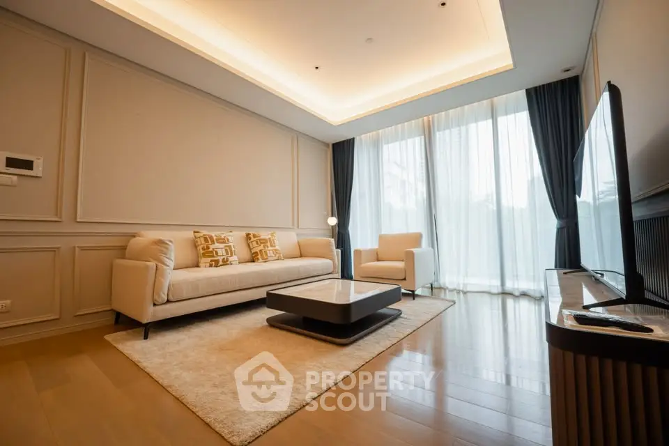 Luxurious modern living room with elegant furniture and large windows