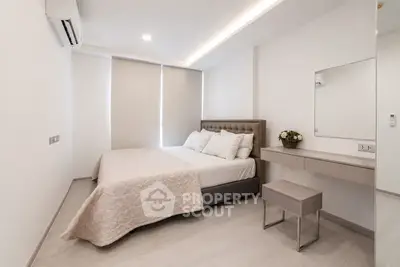 Modern minimalist bedroom with elegant decor and natural light