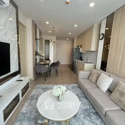 Modern open-plan living room with stylish kitchen and elegant decor