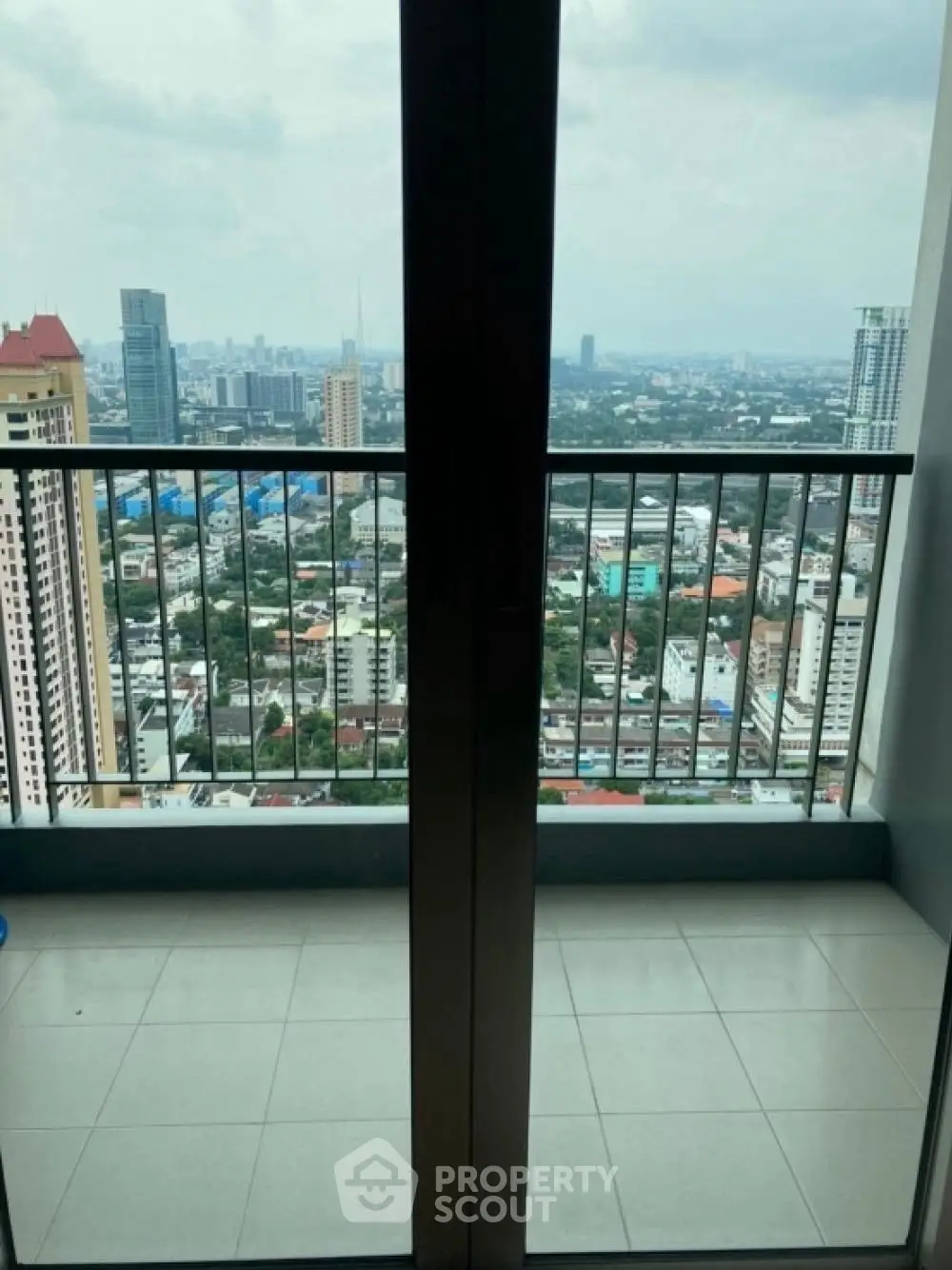 Stunning cityscape view from a high-rise balcony, perfect for urban living enthusiasts.