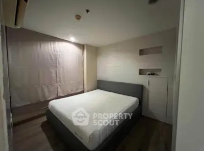 Cozy bedroom with modern design and soft lighting, perfect for relaxation.