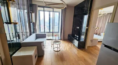 Modern living room with stylish decor and large windows offering city views