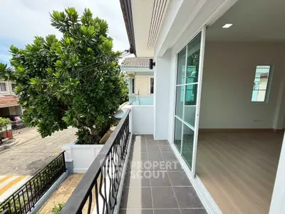 Spacious balcony with sliding glass doors and street view in modern home