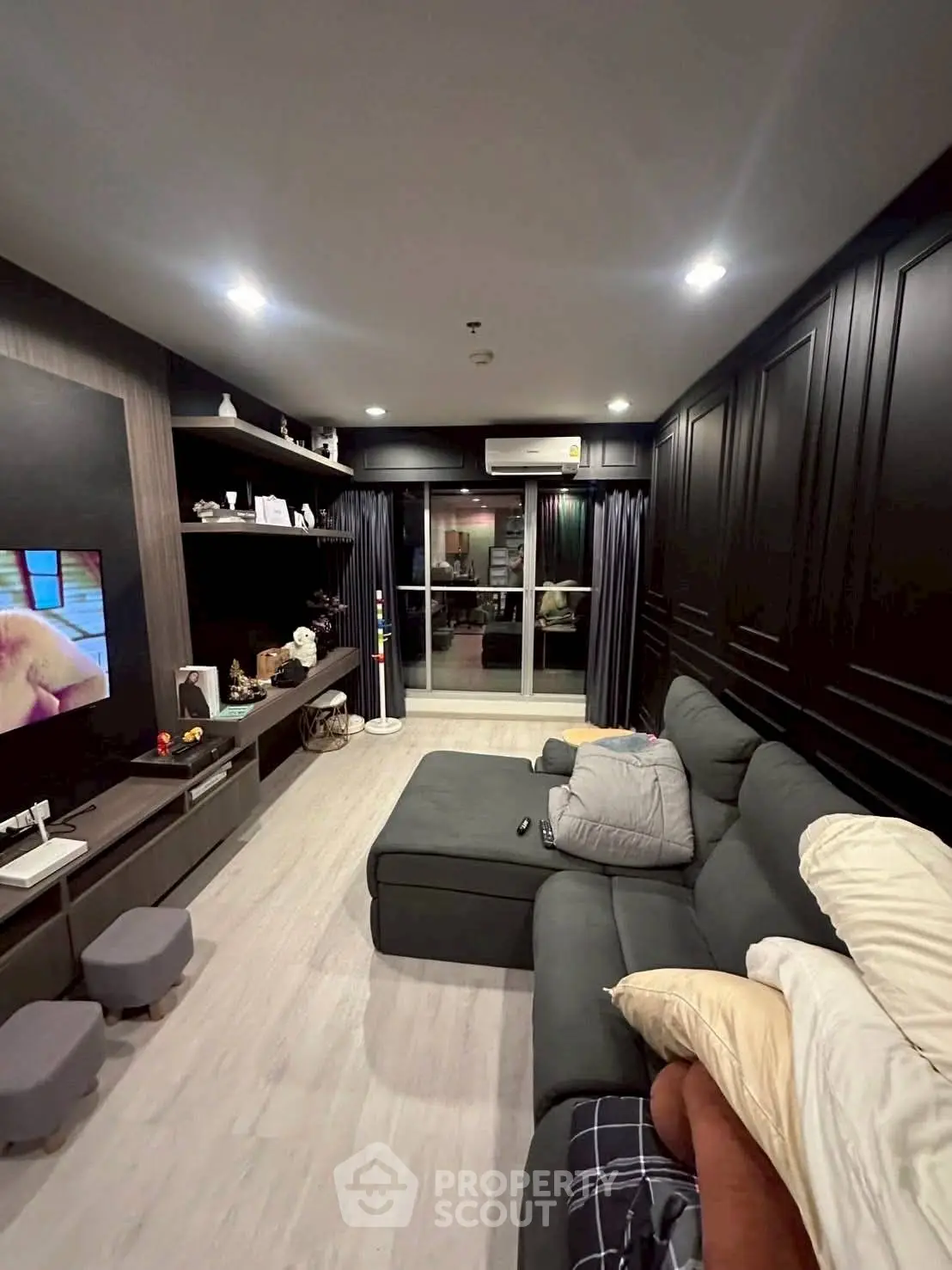 Stylish living room with modern decor and cozy seating area, perfect for relaxation and entertainment.