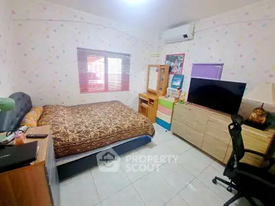 Cozy bedroom with colorful decor and ample storage space