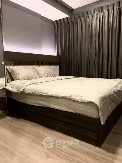 Modern bedroom with elegant decor and cozy ambiance, featuring a stylish bed and luxurious curtains.
