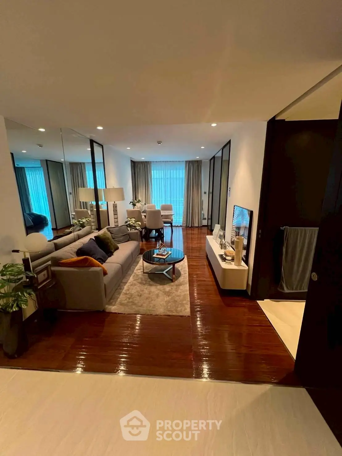 Luxurious living room with elegant decor and spacious layout, featuring a cozy sofa and modern entertainment center.