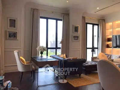 Luxurious living room with elegant decor and large windows offering city views.