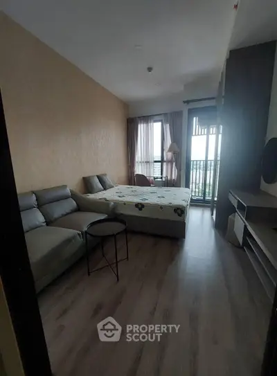 Cozy bedroom with modern decor and balcony view