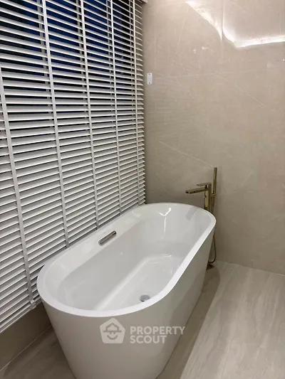 Luxurious bathroom with elegant freestanding bathtub and modern fixtures