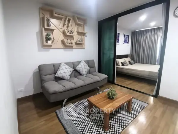 Modern living room with stylish decor and cozy bedroom view
