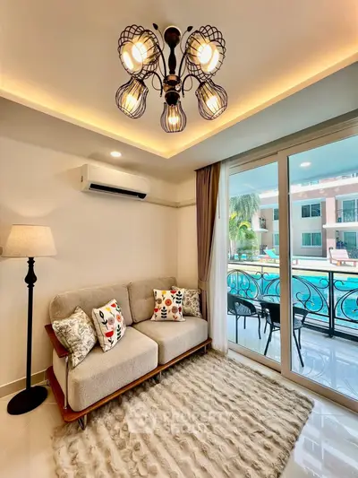 Luxurious living room with pool view, elegant lighting, and cozy seating in modern apartment.