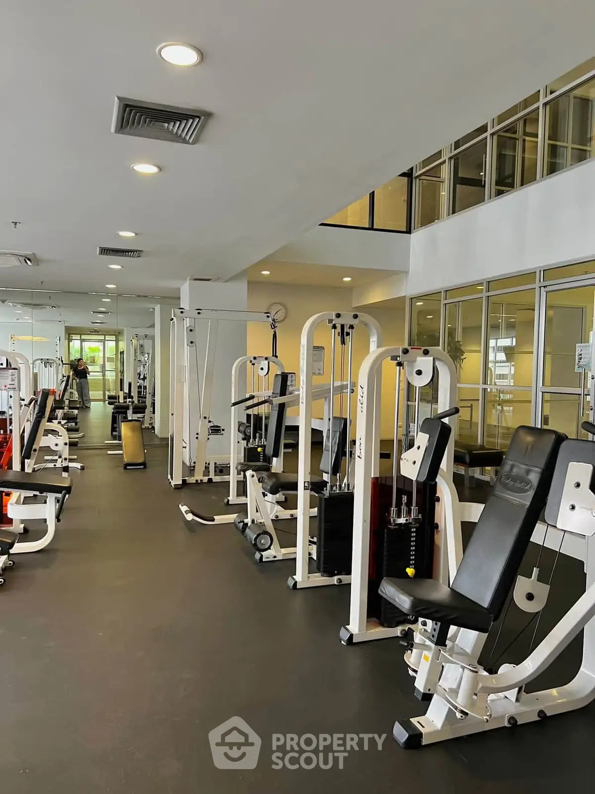Modern gym with state-of-the-art fitness equipment in a residential building.