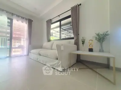 Spacious modern living room with elegant white sofa and stylish decor