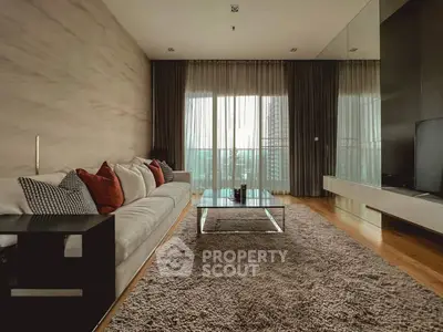 Luxurious modern living room with plush sofa and large windows