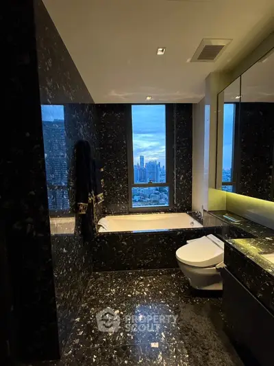 Luxurious black marble bathroom with city skyline view from window