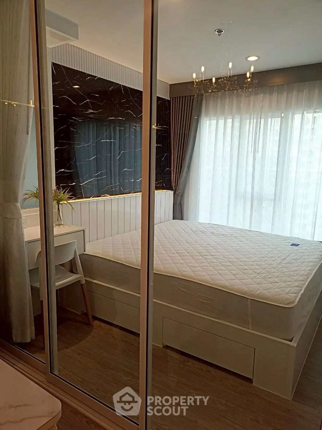Modern bedroom with large windows and elegant decor