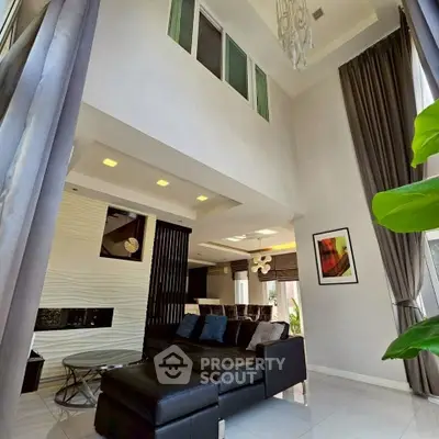 Luxurious modern living room with high ceilings and elegant decor