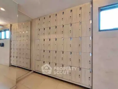 Spacious storage area with modern lockers and natural lighting