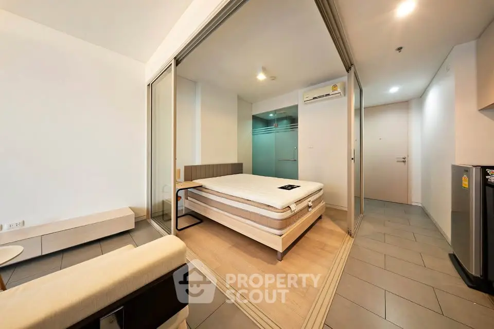 Modern bedroom with glass partition and minimalist design