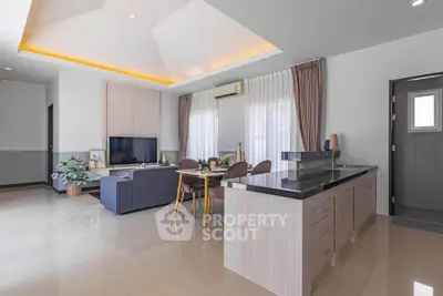 Spacious modern living room with open kitchen and elegant decor