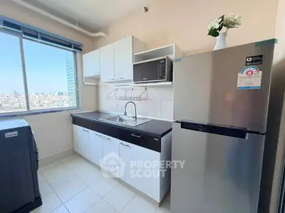 Modern kitchen with city view, stainless steel appliances, and sleek cabinetry.