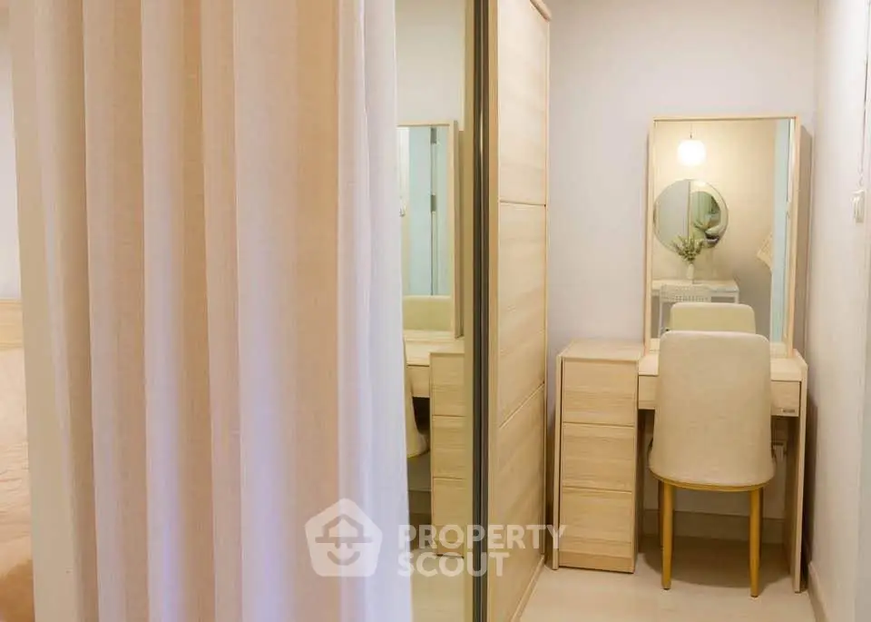 Cozy bedroom corner with elegant vanity and mirror, perfect for a serene morning routine.